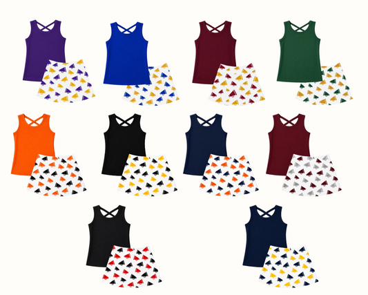 Collection of tank tops and skirts in various colors with patterned skirts on a white background