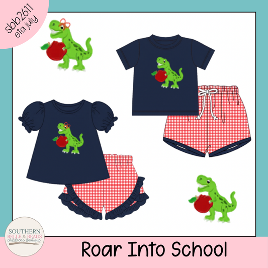 Children's outfit with dinosaur design on navy tops and red checkered shorts, branded 'Southern Belle & Co.'