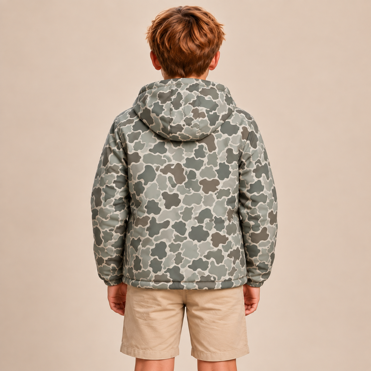 Back view of boys vintage camo rain jacket showing the hood and printed back